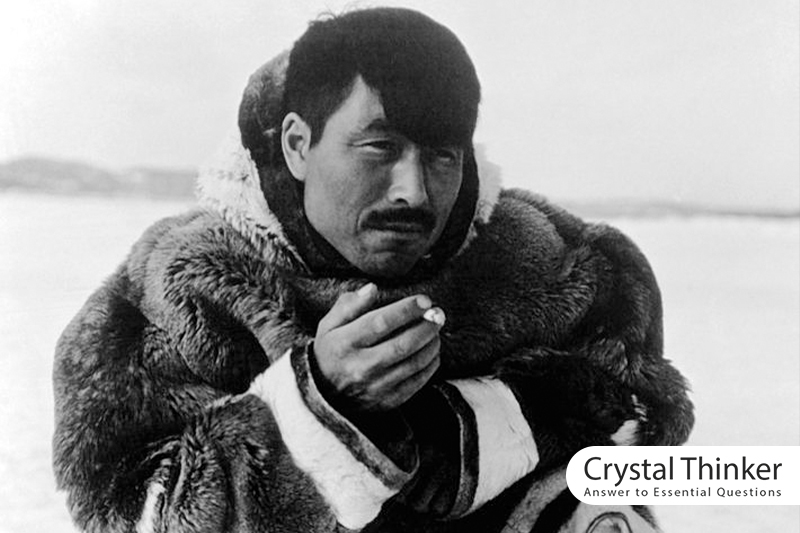 A man from the Inuit is smoking.